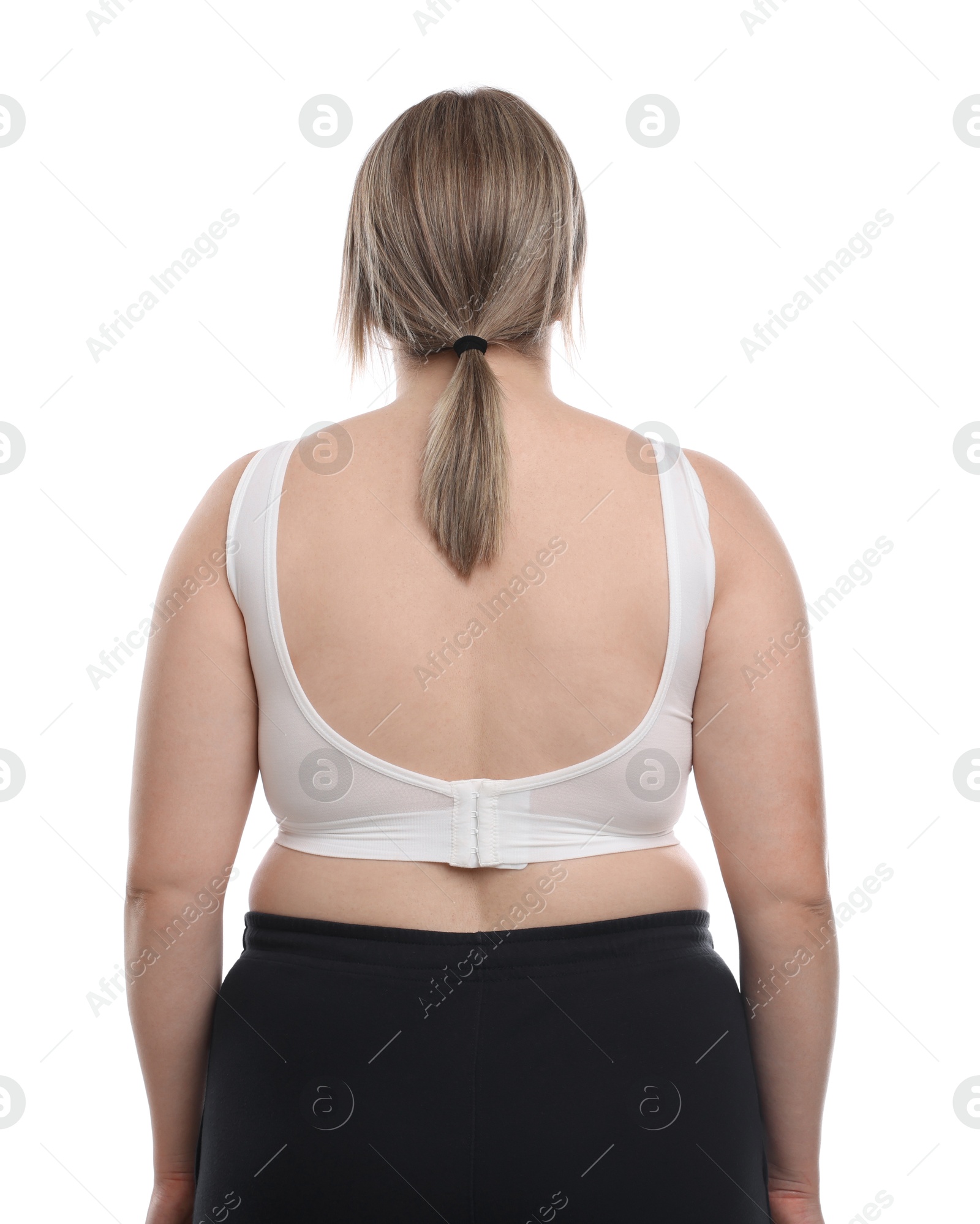 Weight loss. Plus size woman on white background, back view Photo of Weight loss. Plus size woman on white background, back view