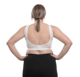 Photo of Weight loss. Plus size woman on white background, back view