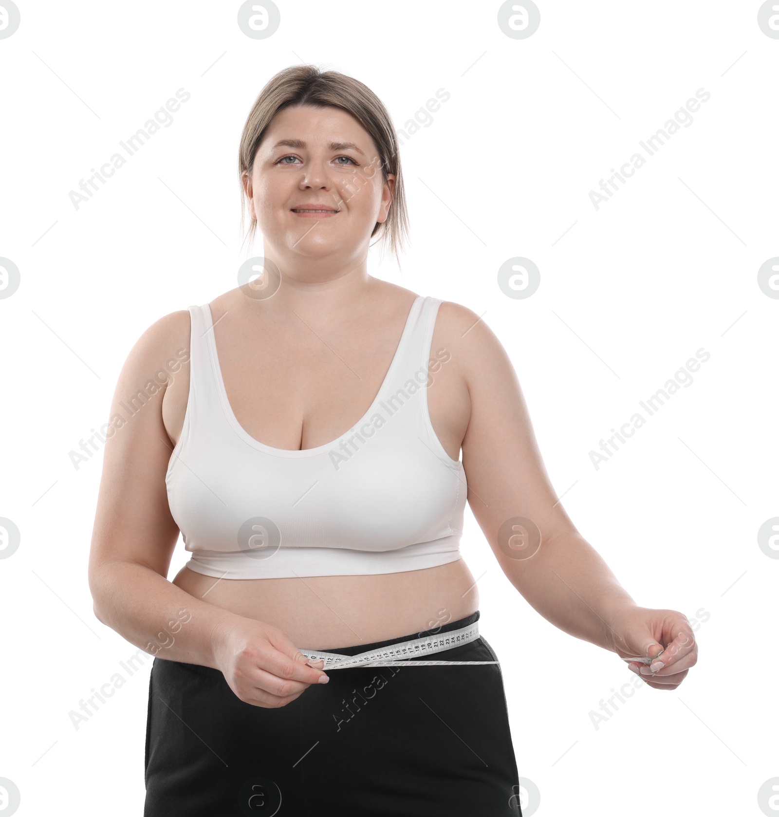 Weight loss. Plus size woman measuring waist with tape on white background Photo of Weight loss. Plus size woman measuring waist with tape on white background