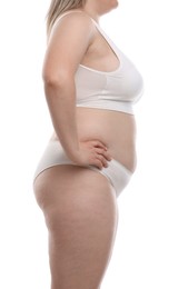 Photo of Weight loss. Plus size woman in underwear on white background, closeup