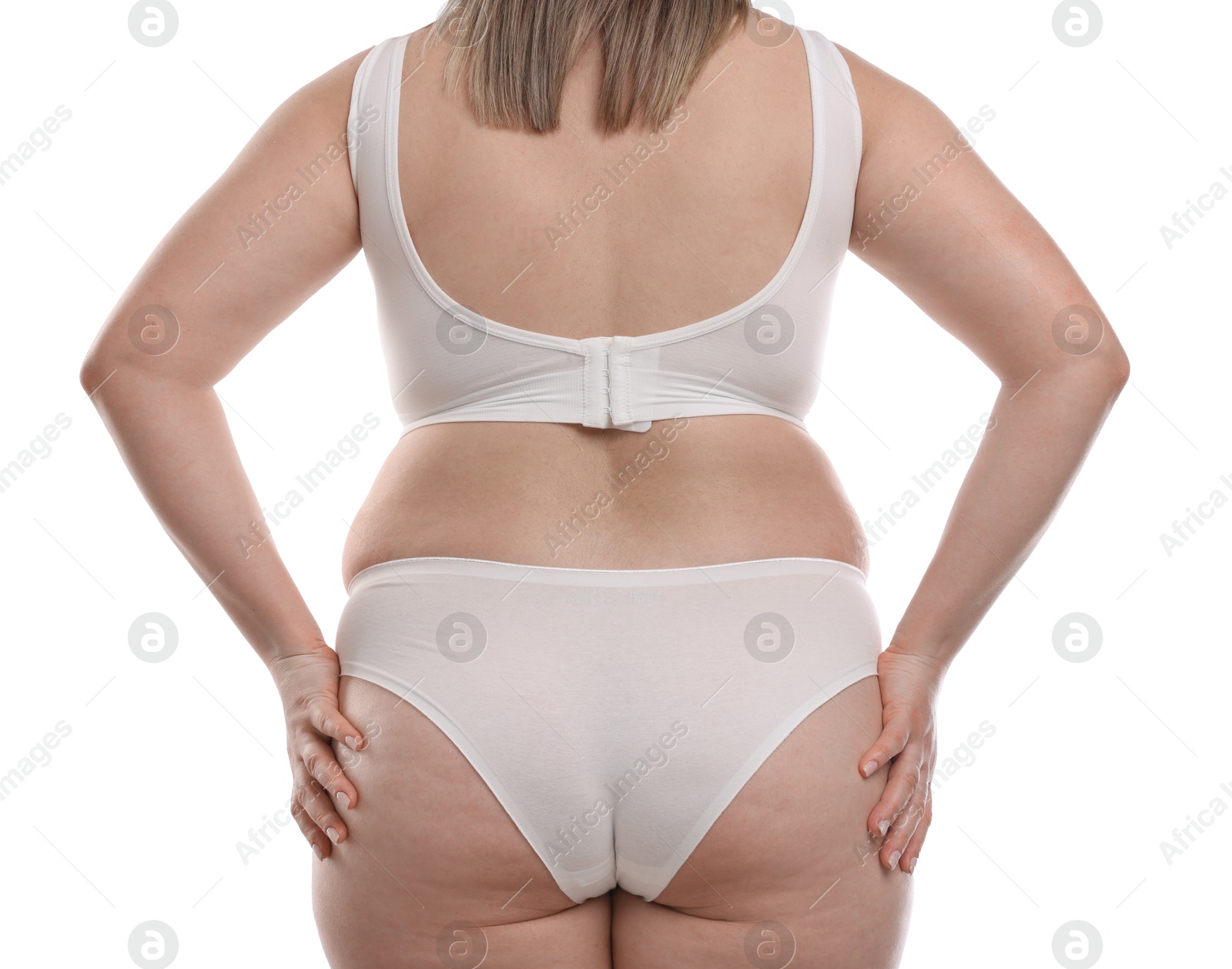 Weight loss. Plus size woman in underwear on white background, closeup Photo of Weight loss. Plus size woman in underwear on white background, closeup