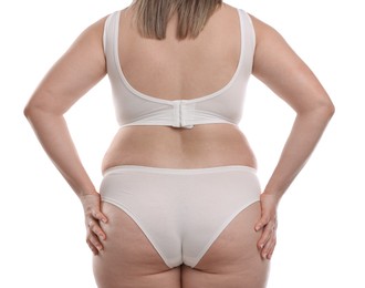 Photo of Weight loss. Plus size woman in underwear on white background, closeup