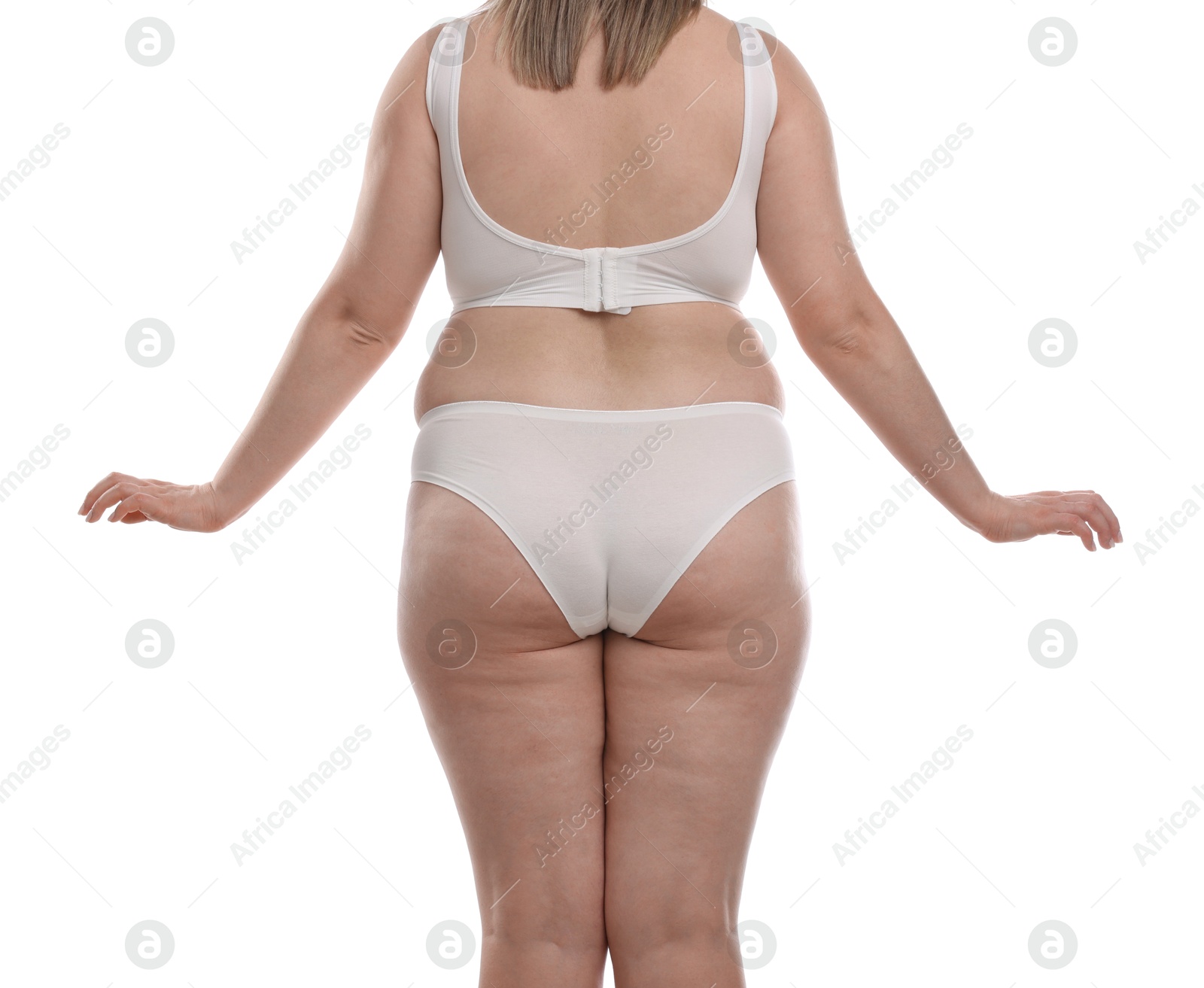 Weight loss. Plus size woman in underwear on white background, closeup Photo of Weight loss. Plus size woman in underwear on white background, closeup