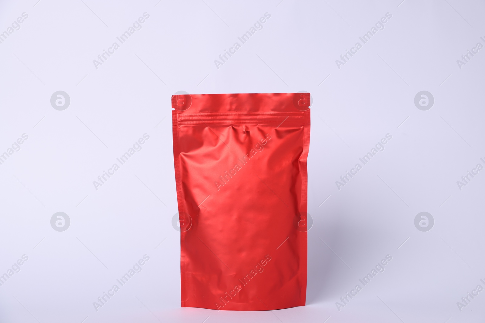 One zipper stand-up pouch on light grey background. Mockup for design Photo of One zipper stand-up pouch on light grey background. Mockup for design