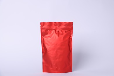 Photo of One zipper stand-up pouch on light grey background. Mockup for design