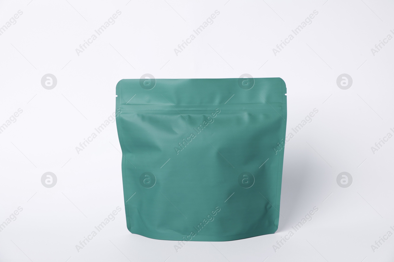 One zipper stand-up pouch on white background. Mockup for design Photo of One zipper stand-up pouch on white background. Mockup for design
