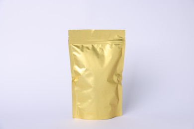 Photo of One zipper stand-up pouch on light grey background. Mockup for design
