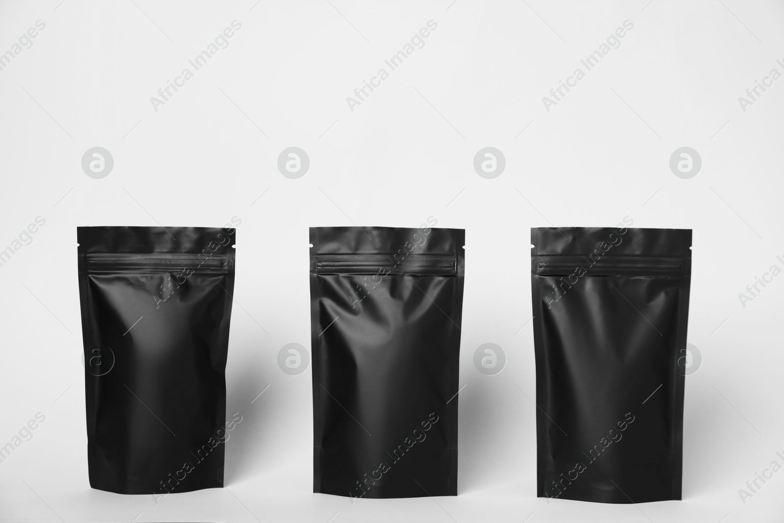 Zipper stand-up pouches on white background. Mockup for design Photo of Zipper stand-up pouches on white background. Mockup for design