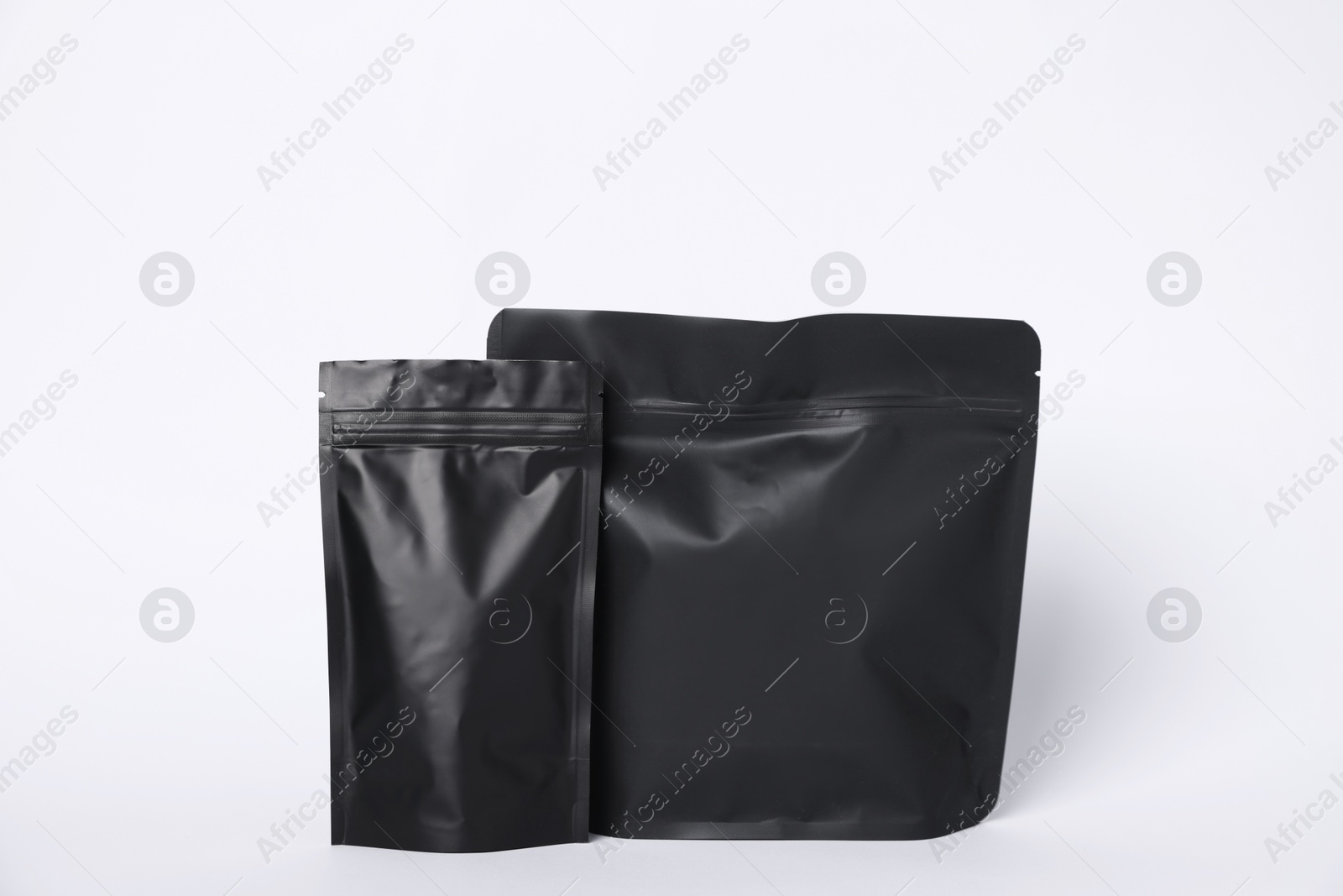 Zipper stand-up pouches on white background. Mockup for design Photo of Zipper stand-up pouches on white background. Mockup for design
