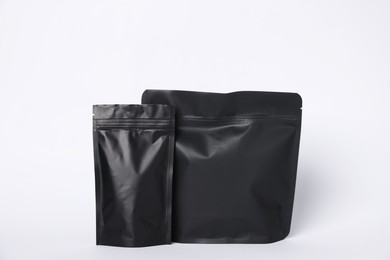 Photo of Zipper stand-up pouches on white background. Mockup for design
