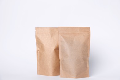 Photo of Zipper stand-up pouches on white background. Mockup for design