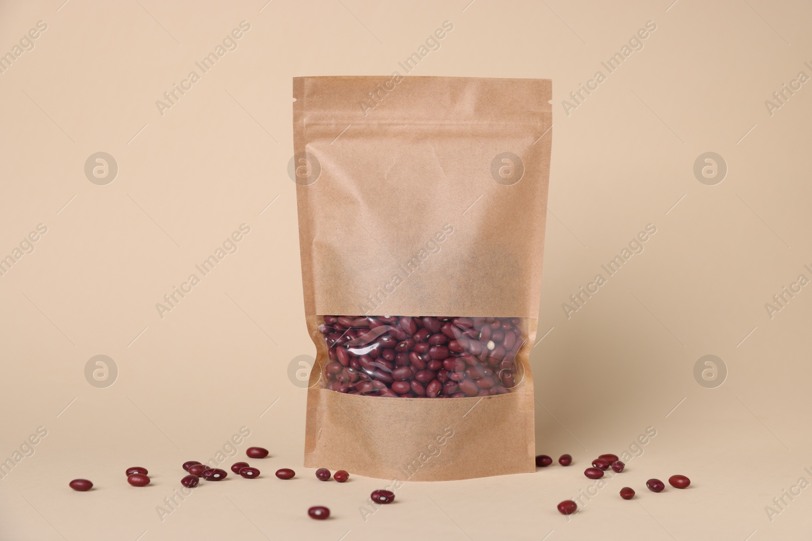 One zipper stand-up pouch with kidney beans on beige background. Mockup for design Photo of One zipper stand-up pouch with kidney beans on beige background. Mockup for design