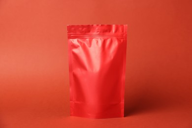Photo of One zipper stand-up pouch on red background. Mockup for design