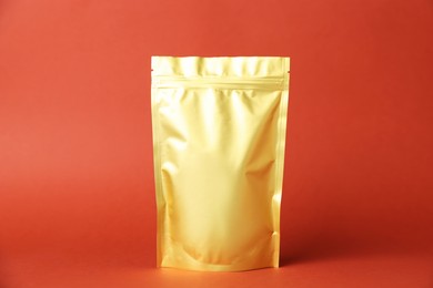 Photo of One zipper stand-up pouch on red background. Mockup for design