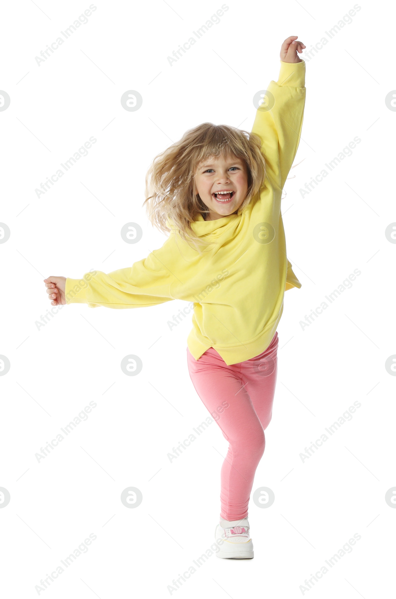 Happy little girl dancing on white background Photo of Happy little girl dancing on white background