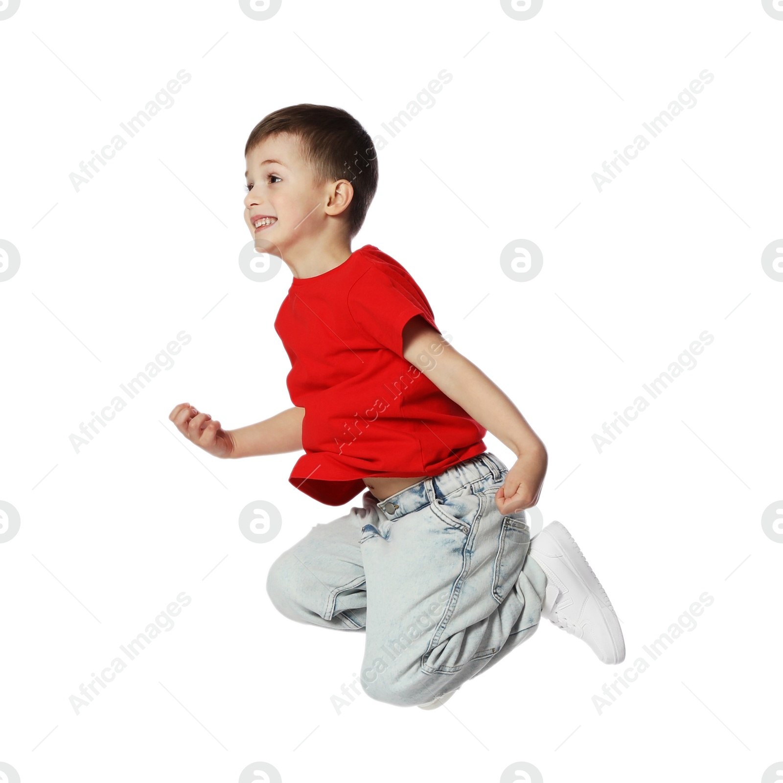 Happy little boy dancing on white background Photo of Happy little boy dancing on white background