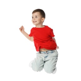 Photo of Happy little boy dancing on white background