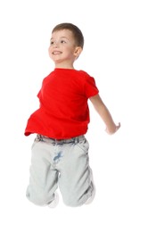 Photo of Happy little boy dancing on white background