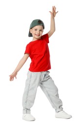 Photo of Happy little boy in baseball hat dancing on white background