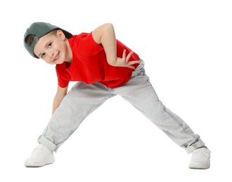Photo of Happy little boy in baseball hat dancing on white background