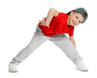 Photo of Happy little boy in baseball hat dancing on white background