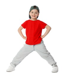 Photo of Happy little boy in baseball hat dancing on white background
