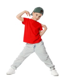 Photo of Cute little boy in baseball hat dancing on white background