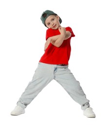 Photo of Cute little boy in baseball hat dancing on white background