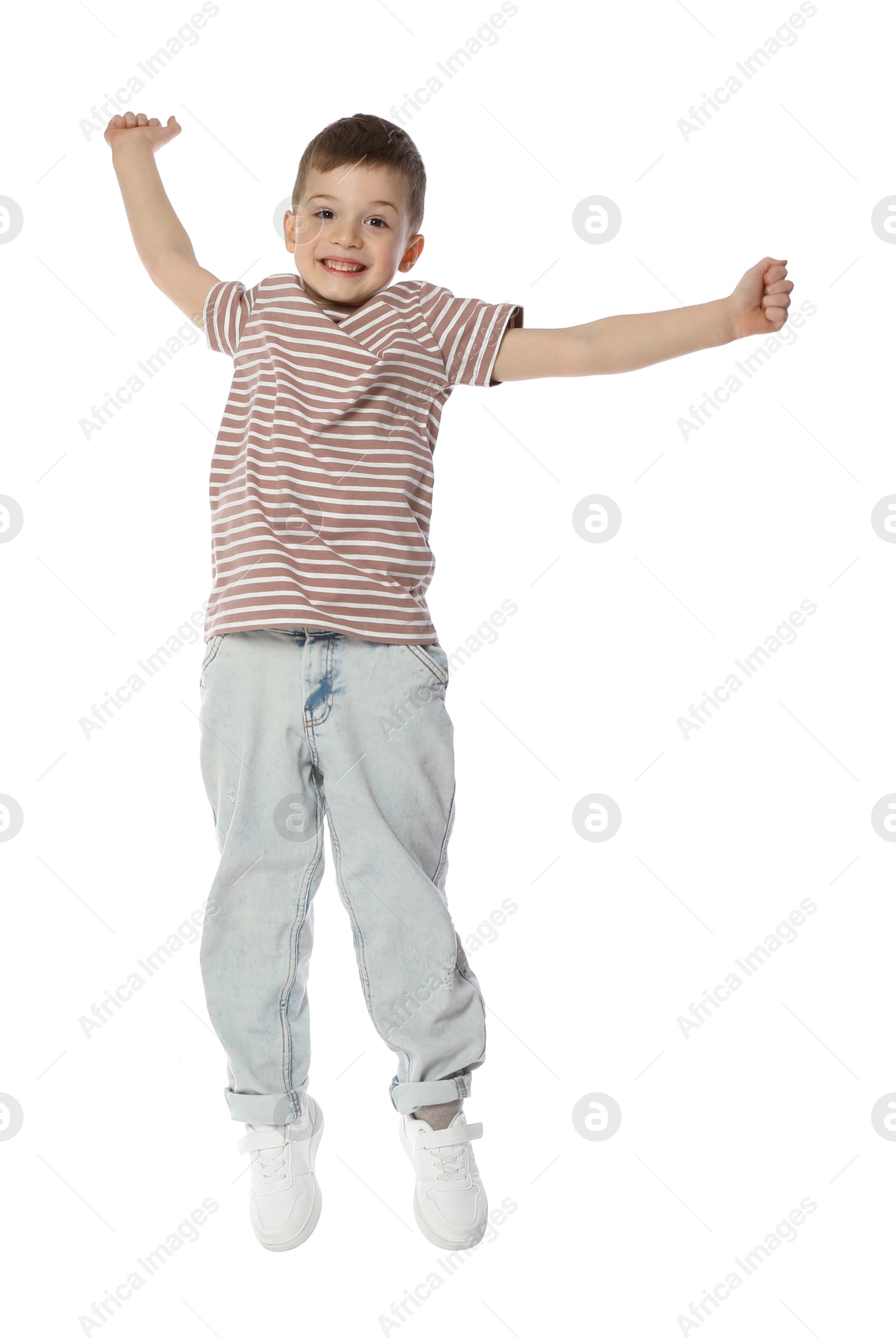 Happy little boy dancing on white background Photo of Happy little boy dancing on white background