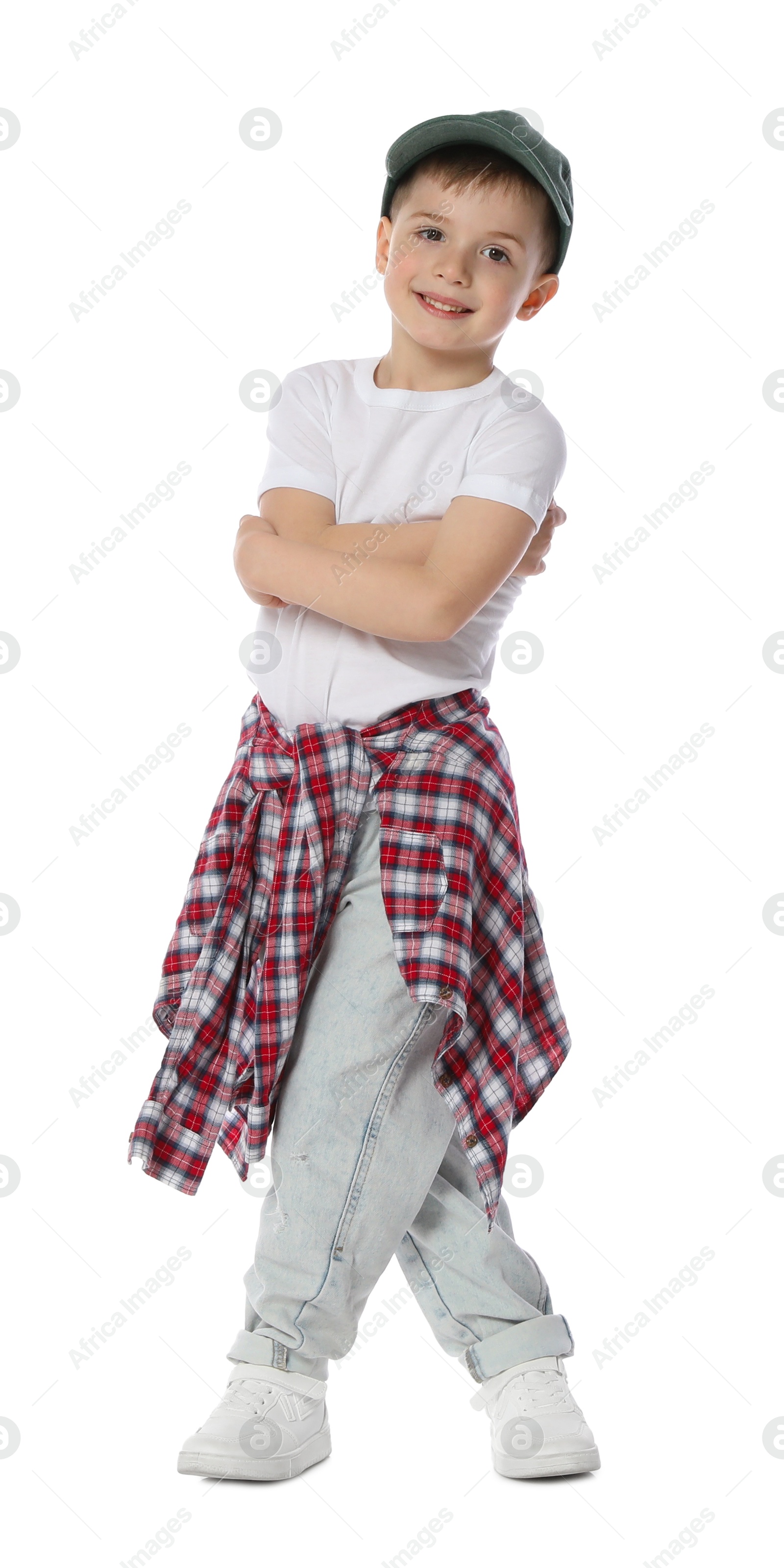 Happy little boy in baseball hat dancing on white background Photo of Happy little boy in baseball hat dancing on white background