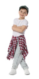 Photo of Happy little boy in baseball hat dancing on white background