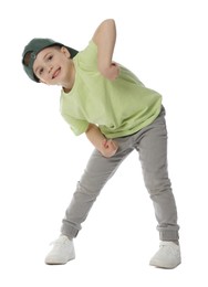 Photo of Happy little boy in baseball hat dancing on white background