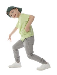 Photo of Happy little boy in baseball hat dancing on white background