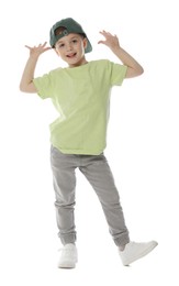 Photo of Happy little boy in baseball hat dancing on white background