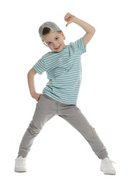 Photo of Happy little boy in baseball hat dancing on white background
