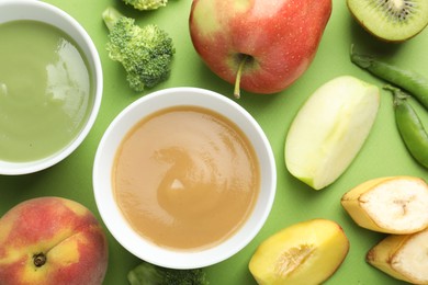 Photo of Baby food. Tasty puree in bowls and ingredients on green background, flat lay