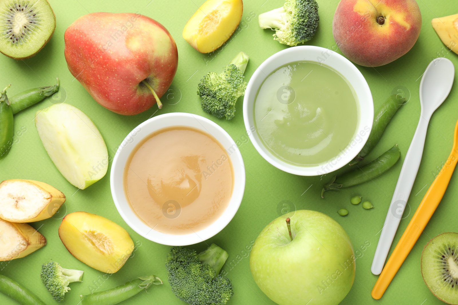 Baby food. Tasty puree in bowls and ingredients on green background, flat lay Photo of Baby food. Tasty puree in bowls and ingredients on green background, flat lay