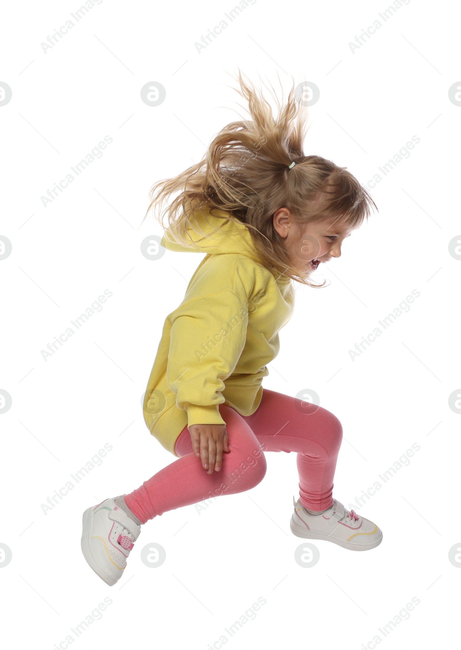 Happy little girl dancing on white background Photo of Happy little girl dancing on white background