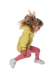 Photo of Happy little girl dancing on white background