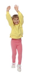 Photo of Happy little girl dancing on white background