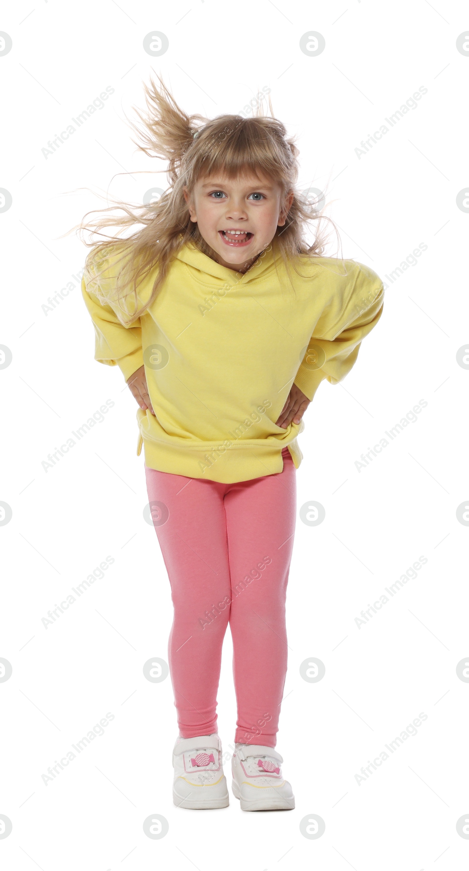 Happy little girl dancing on white background Photo of Happy little girl dancing on white background