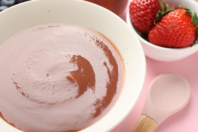 Photo of Baby food. Tasty puree in bowl and ingredients on pink background, closeup