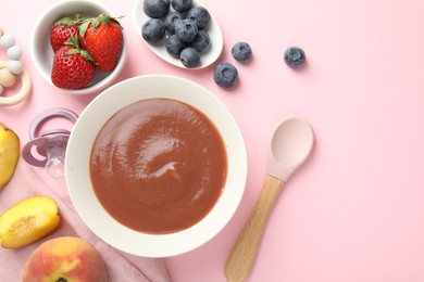 Photo of Baby food. Tasty puree in bowl, pacifier, teether and ingredients on pink background, flat lay