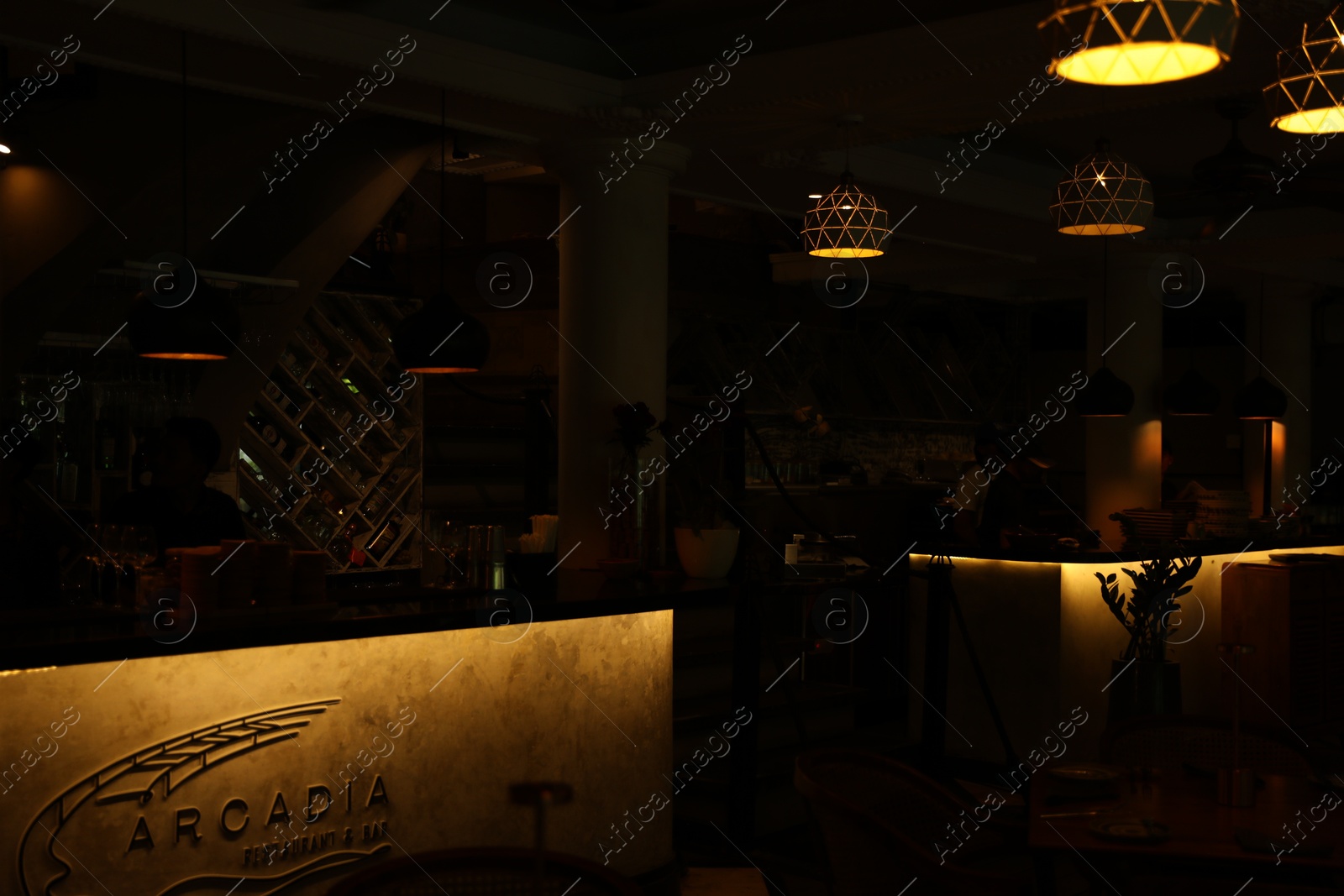 Bali, Indonesia - May 12, 2025: Stylish furniture and lamps inside Arcadia restaurant Photo of Bali, Indonesia - May 12, 2025: Stylish furniture and lamps inside Arcadia restaurant