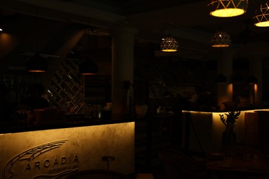 Photo of Bali, Indonesia - May 12, 2025: Stylish furniture and lamps inside Arcadia restaurant