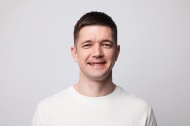 Photo of Portrait of handsome man on light background
