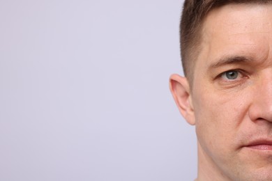 Photo of Handsome man on light background, closeup. Space for text