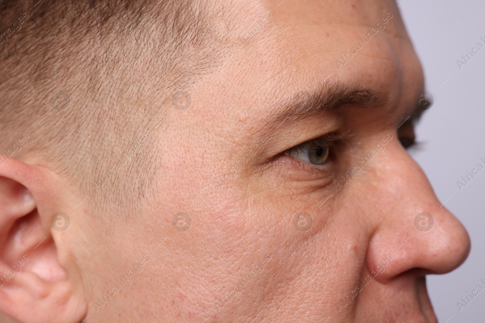 Handsome man on light background, closeup view Photo of Handsome man on light background, closeup view