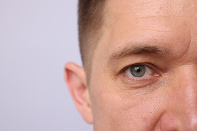 Photo of Handsome man on light background, closeup view