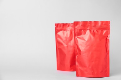 Photo of Zipper stand-up pouches on light grey background. Mockup for design